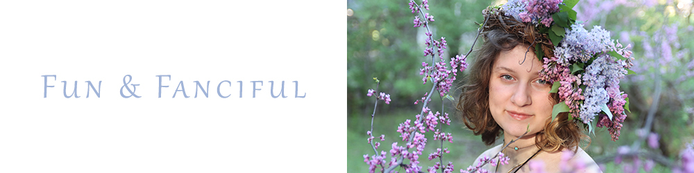 Young woman with a lilac flower crown standing near Red Bud blooming trees