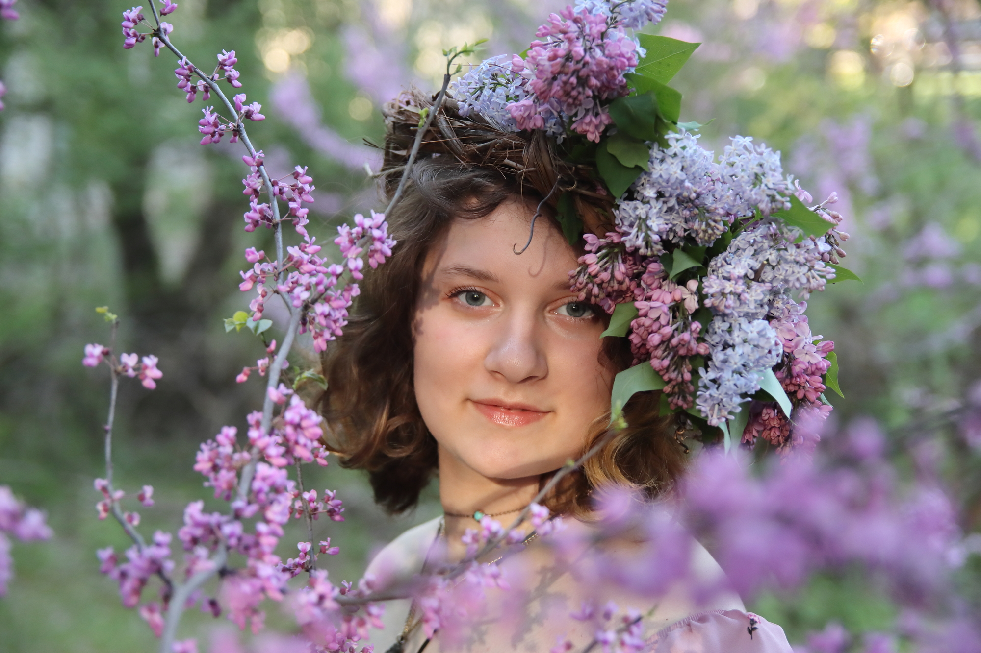 young woman posing with a flower crown on her head