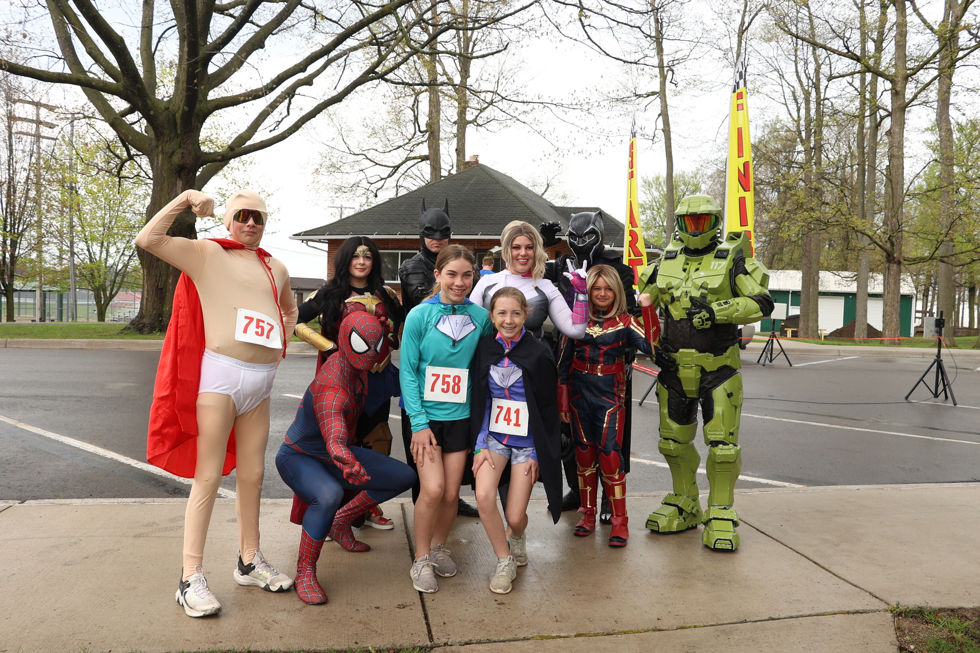 a group of racer dressed up like super heros