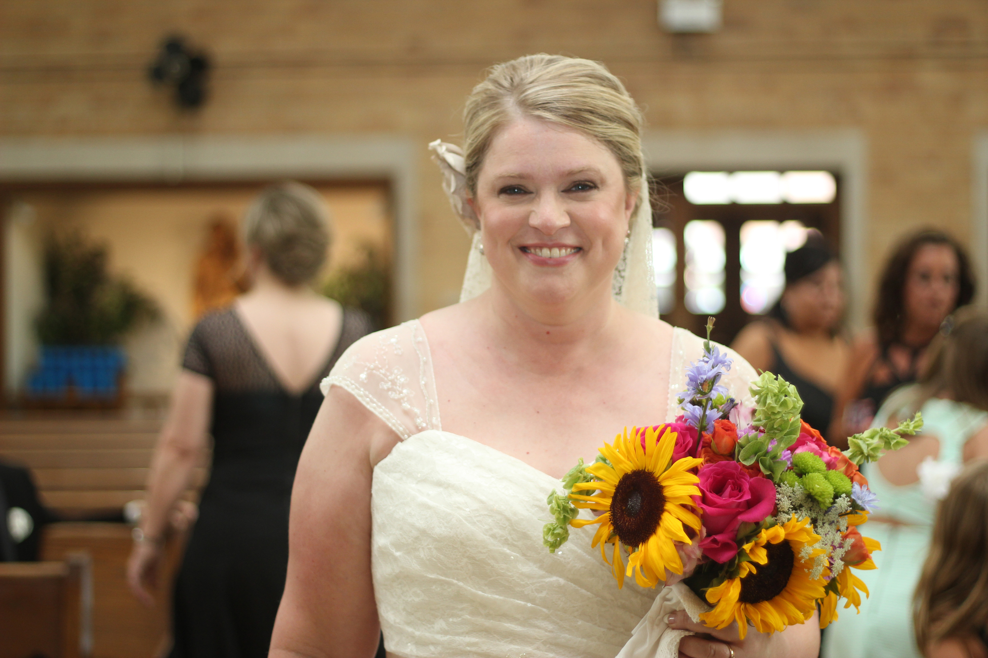 beautiful bride with a sunflower bouquet